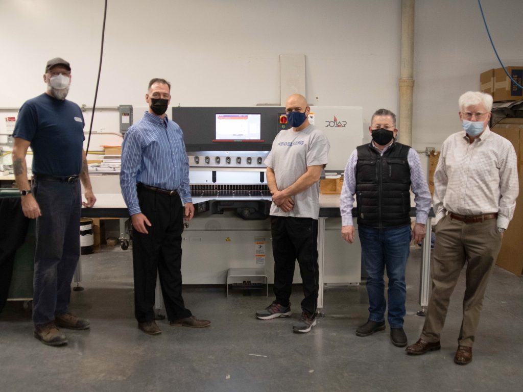 Paul Shaver, Heidelberg service technician; Tom Cummings, Heidelberg account manager; Mike Lima, Braintree Printing operator; Jose Tafur, Braintree Printing owner; and Jim Corliss, Braintree Printing marketing manager with the new POLAR 115 from Heidelberg.