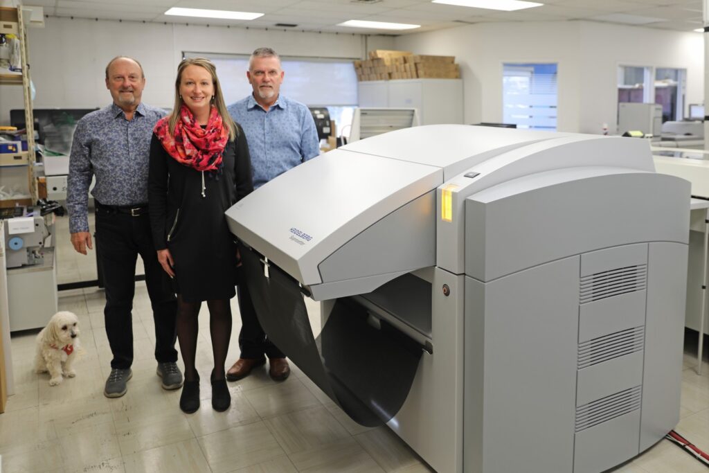 Abby, CMO; Doug Kletke, CEO & owner; Pam Kletke, VP; and Dave Kletke, president & owner with the new Suprasetter A75. Photo courtesy Heidelberg